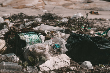 Real nature life climate crisis, land near forest park pollution. Dirty ground, throwing outdoor plastic litter waste, need environmental protection. Problem of garbage caused by man made