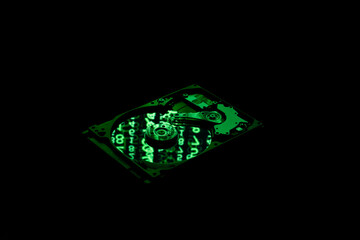 hard drive with green matrix on black background