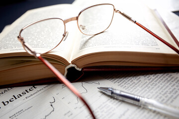 glasses on the book pages