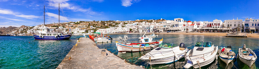 Fototapeta na wymiar Mykonos island. Greece summer holidays. Panorama of old port in downtown. view with boats bars and restaurants. Cyclades.