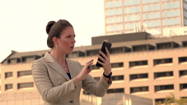 Businesswoman shocked by news on tablet