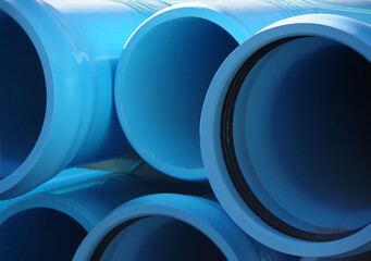 Full frame close-up view of stacked blue main water pipes