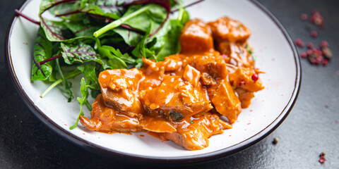 meat tomato sauce spezzatino pork beef lamb fresh portion dietary healthy meal food diet still life snack on the table copy space food background rustic top view keto or paleo diet