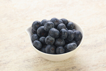 Sweet ripe blueberry heap in the bowl