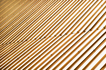 Corrugated metal profile roof installed on a barn house. The roof of corrugated sheet. Roofing of metal profile wavy shape. Modern roof made of metal. Metal roofing.