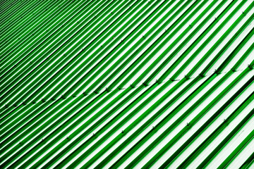 Corrugated metal profile roof installed on a barn house. The roof of corrugated sheet. Roofing of metal profile wavy shape. Modern roof made of metal. Metal roofing.