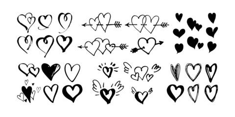 Hand drawn hearts with little wings and pierced with arrow. Symbol of love. Doodle style Valentine's day illustration. Vector.