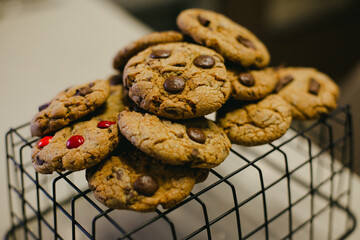 Homemade crunchy chocolate chip cookies placed on a wire rack to cool after baking