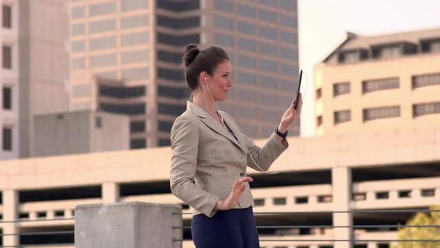 Businesswoman speaking to her family from a foreign country