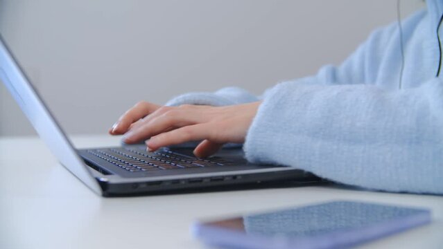 Business woman working on laptop computer in office. Hands of freelance writer person typing text on notebook pc keyboard. Female doing distant work online during lockdown in 4k stock video
