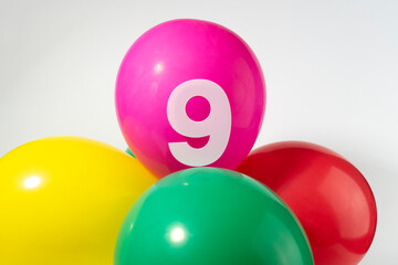Number 9 and colourful round balloons. Birthday, anniversary, jubilee concept.