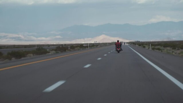 Biker driving on the Highway on legendary Route 66 to Oatman, Arizona.