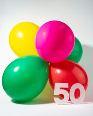 Number 50 and colourful round balloons. Birthday, anniversary, jubilee concept.