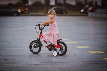 small child riding a tricycle