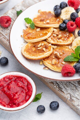 Keto pancakes made of diet flour or almond flour, served with berries.