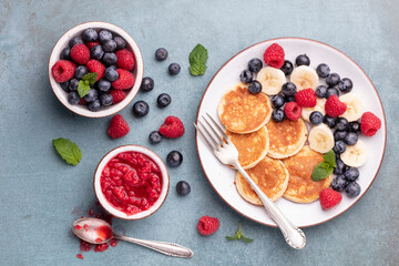 Keto pancakes made of diet flour or almond flour, served with berries.