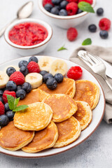 Keto pancakes made of diet flour or almond flour, served with berries.