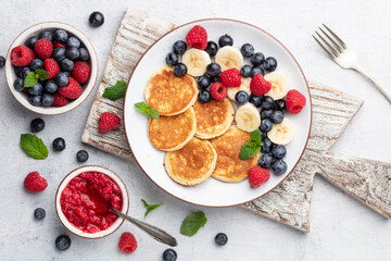 Keto pancakes made of diet flour or almond flour, served with berries.