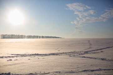 A field covered with snow in winter