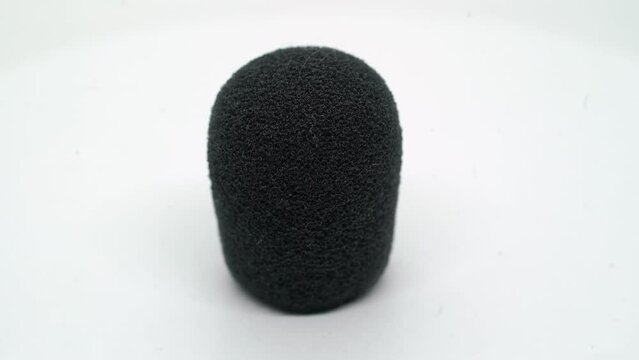 Black foam windshield for microphone. Dead cat sound recording equipment.