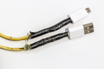 USB charging cable damaged at both ends. The usb ports of the cable are wrapped with black tape.