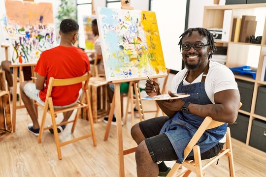 Group of young african american artist man smiling happy drawing at art studio.