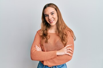 Young blonde woman wearing casual clothes happy face smiling with crossed arms looking at the camera. positive person.