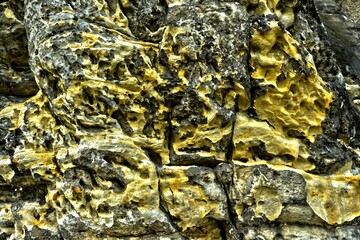 texture of sandstone rock saxon switzerland yellow grey background
