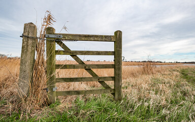 Wooden gate on a public footpath along the River Bure in Norfolk, UK