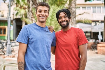 Two african american man smiling happy standing at the city.