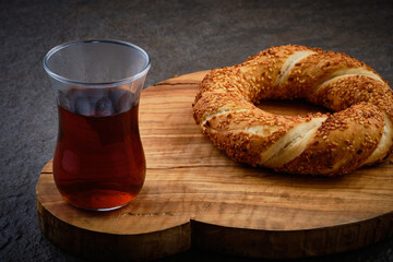 Simit and turkish tea. Traditional turkish breakfast. Sesame encrusted bagel and tea served on a...