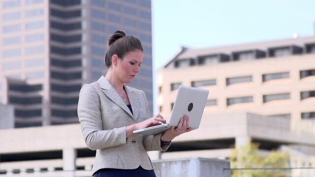 Businesswoman typing on laptop computer