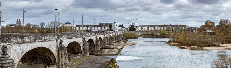 Obraz premium autumn panoramic view of the 18th century stone bridge Wilson bridge over the Loire river in Tours is one of the largest cities in the Centre-Val de Loire region of France