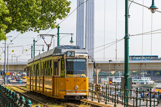 Budapest, Hungary: Tram No. 2 moves along Danube river near Petofi ter. Budapest tram network is one of world largest tram networks, total route is over 156km. In operation since 1866