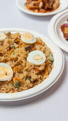 Nigeria Jollof rice with spicy chicken and side sauce