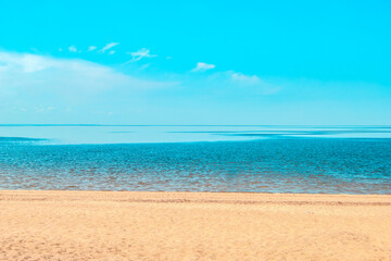 Fototapeta na wymiar Calm on the Baltic Sea coast. The Gulf of Finland on a clear sunny summer day. Background. Copy space.