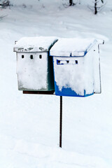 Mailboxes by the road in the snow. Finland