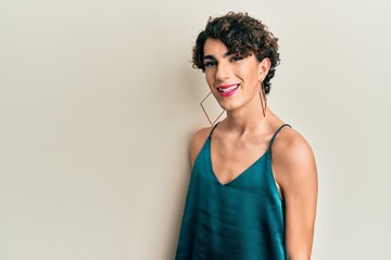 Young transgender man wearing make up and woman clothes, looking fashion and glamorous