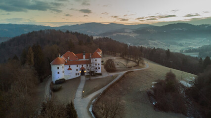 Beautiful aerial drone view of bogensperk castle close to Litija, Slovenia in early morning winter sunset. Morning panorama of Bogensperk castle.ž