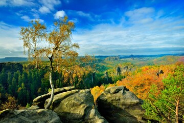 Saxon switzerland fairy tale view from carola rock at noon feather clouds blue sky