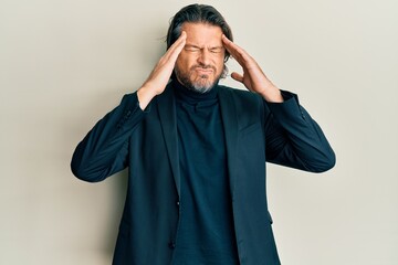 Middle age handsome man wearing business clothes with hand on head, headache because stress....