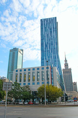 Naklejka premium Beautiful architecture and street in Polish capital Warsaw. Skyscrapers in city