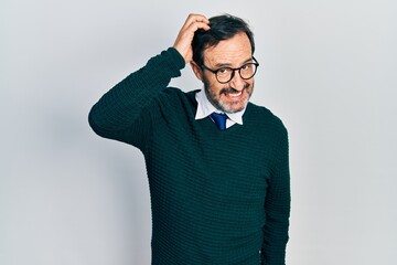 Middle age hispanic man wearing casual clothes and glasses confuse and wonder about question....