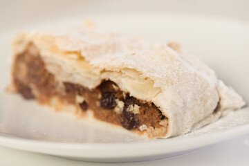 Making of classic strudel fille with apples, cranberries, walnuts and cinnamon