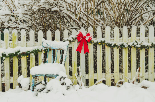 Red ribbon with chair in snow