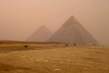 Desert sandstorm in Egypt View of the Pyramids near Cairo city in Egypt