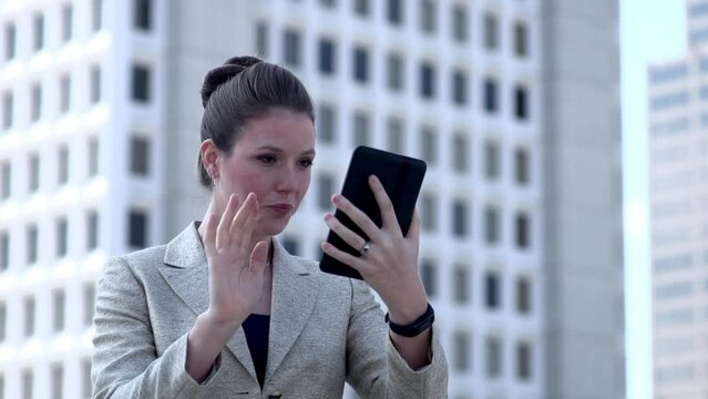 Excited Businesswoman gets good news on her tablet