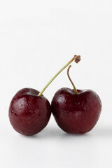 Double ripe cherries isolated on white background.