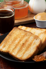 Delicious toasted bread served with jelly or peanuts cream. Selective focus.