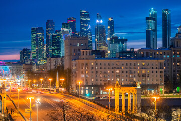 Moscow at night. Russian Federation. Cities of Russia. Landscape with lights of night Moscow. Moscow City area in background. Traveling in Russia. Road in capital of Russia is lit by lanterns.
